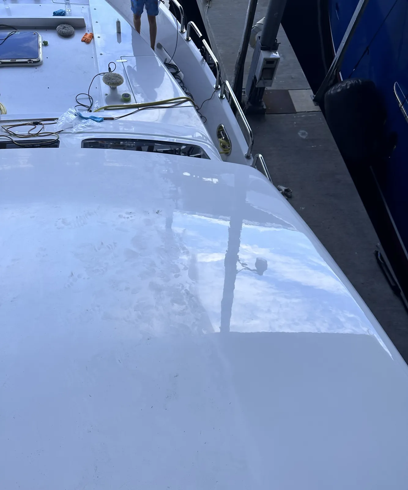 Yacht hardtop at Roscioli Yachting Center in Fort Lauderdale compounded to a mirror gloss on one half and still hazy on the other