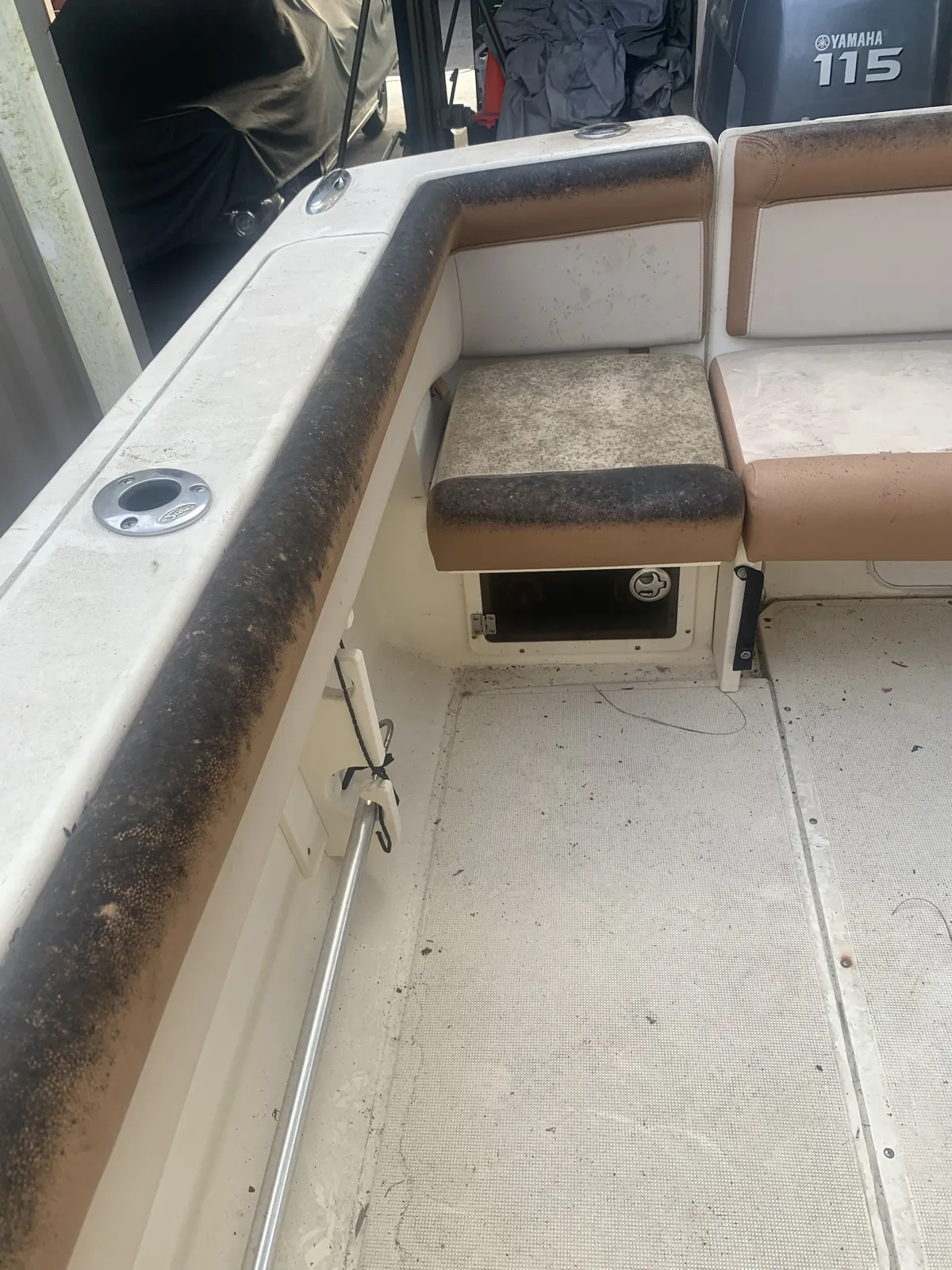 Mildew-stained Scout boat seats and a dirty deck before detailing in Loxahatchee, Florida